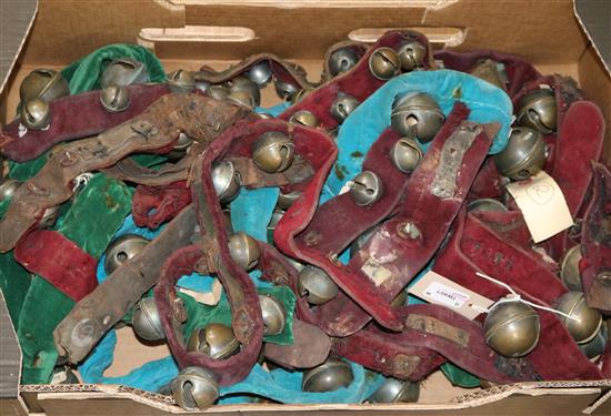 A collection of chromatic crotal, rumbler and harness bells, some plated, most fixed to velvet-covered straps (200+, with music)
